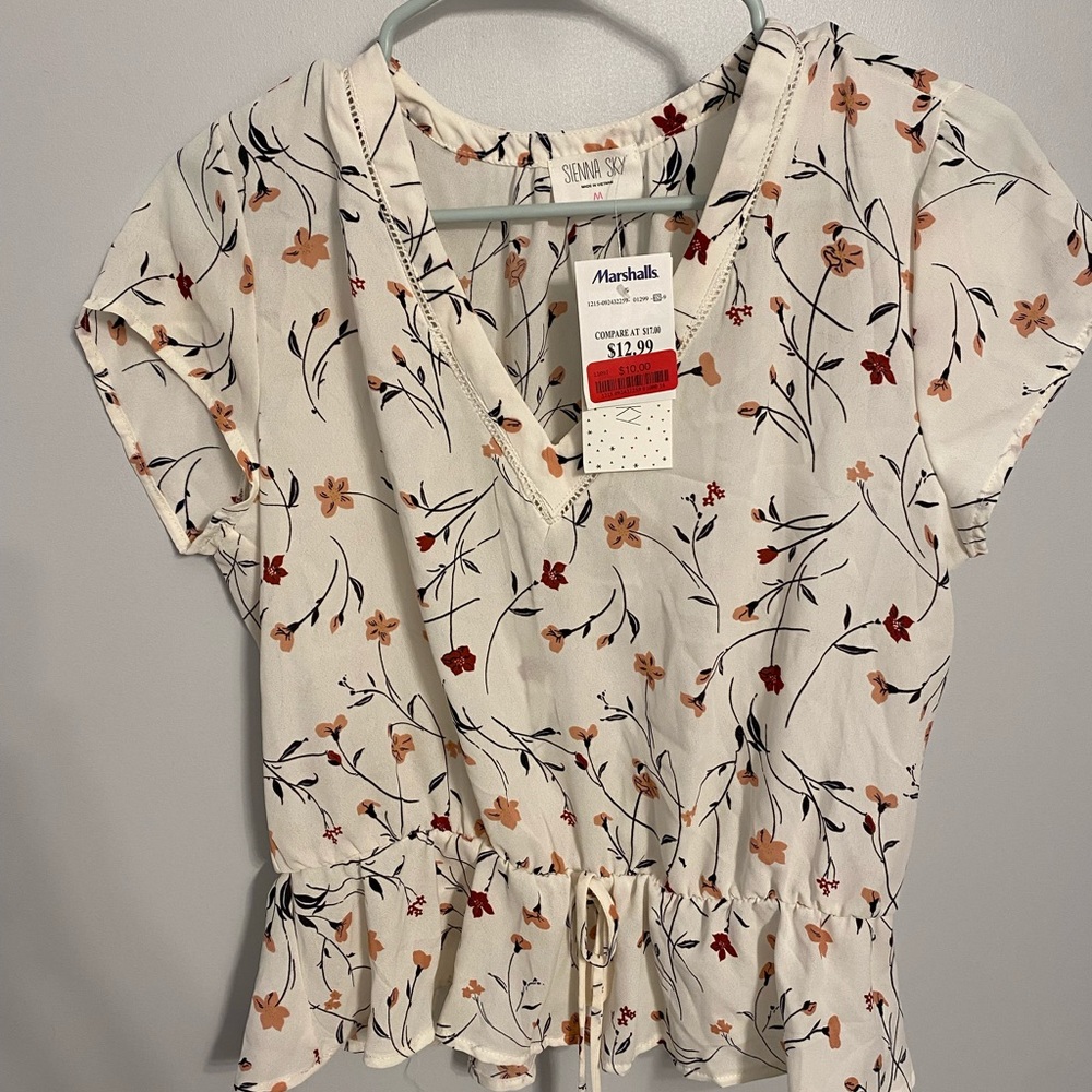 Pink and white floral blouse